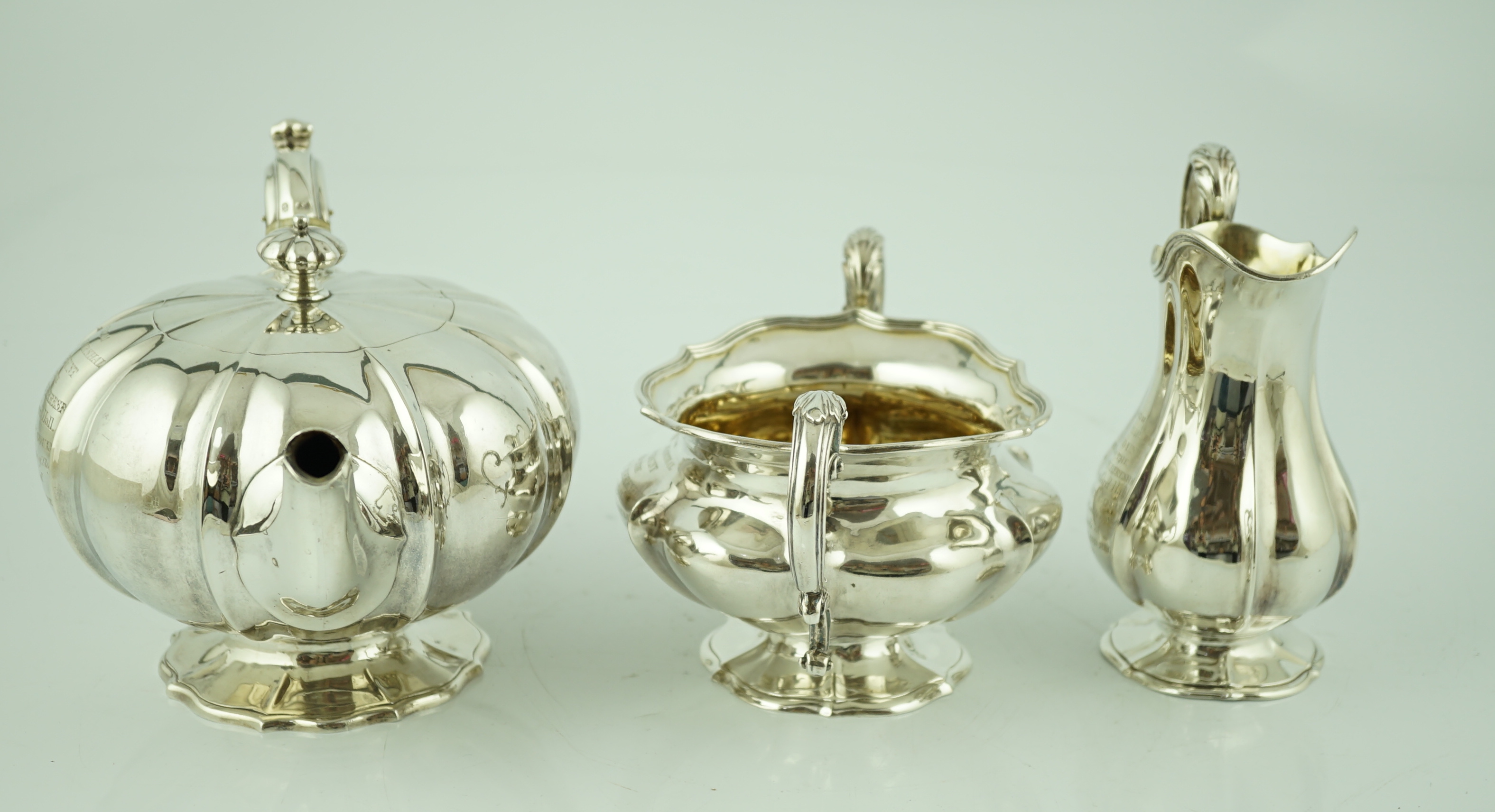 A matched three piece William IV and Victorian silver tea service, the teapot inscribed to 'Field Marshall Viscount Beresford, Beresford Hall 1849'